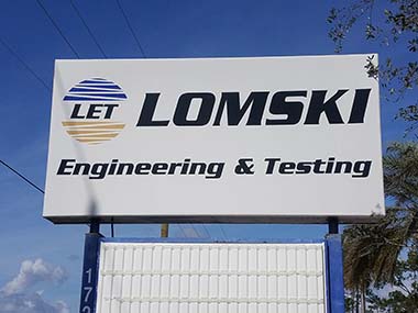 This is Lomski business sign after pressure washing